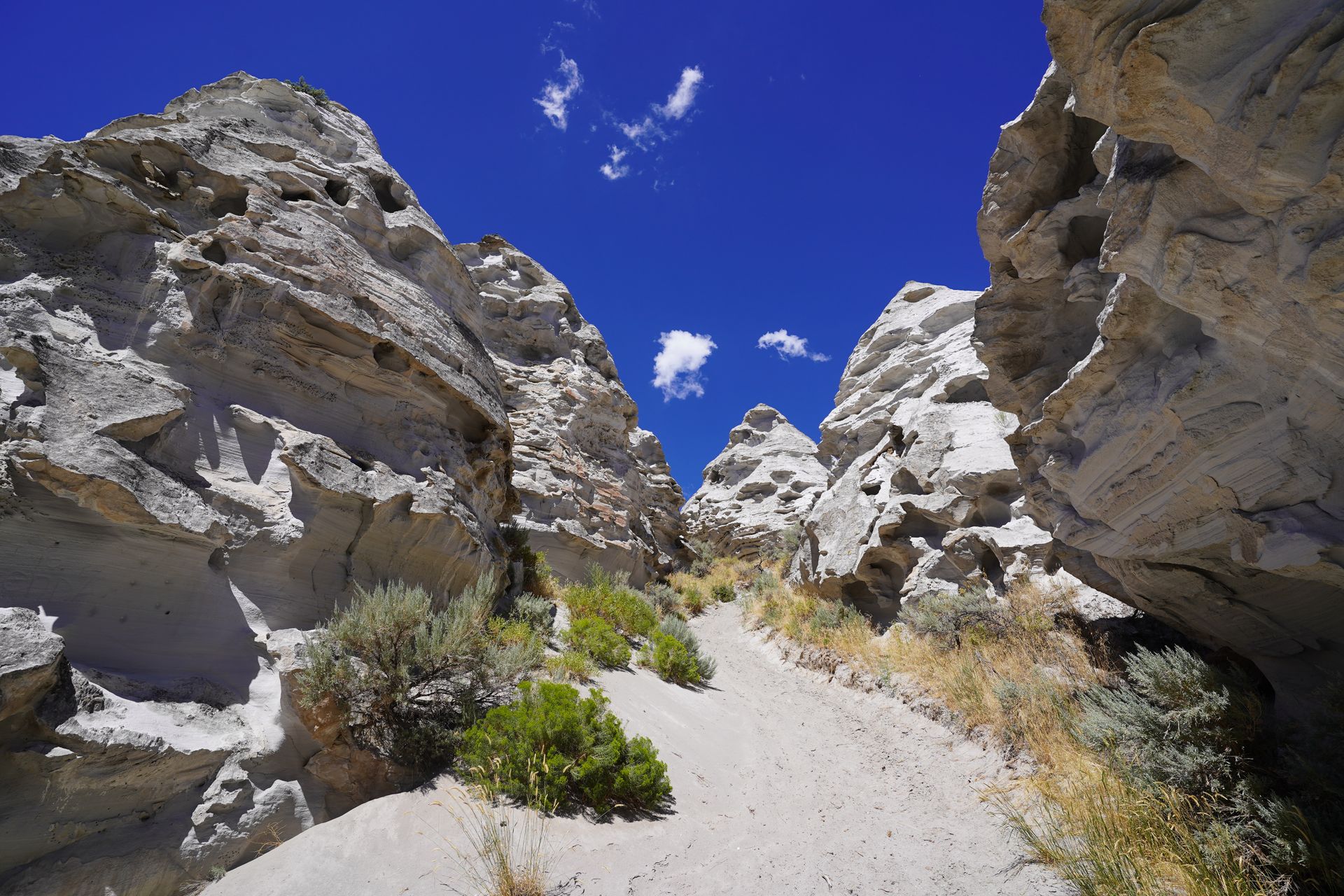 Several white rock towers forming a shape resembling a teepee