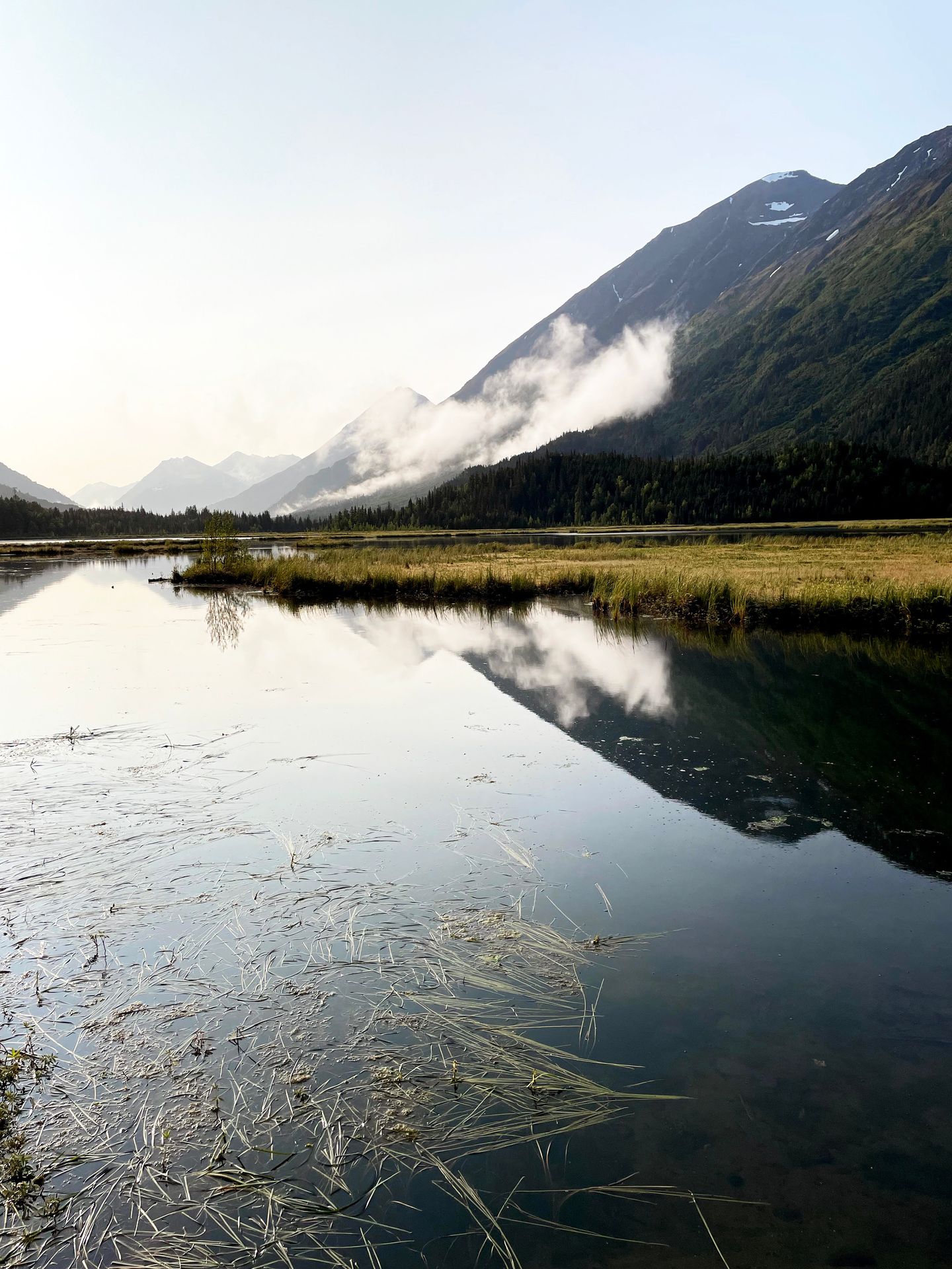 Tern Lake with a mountain reflection and some fog.