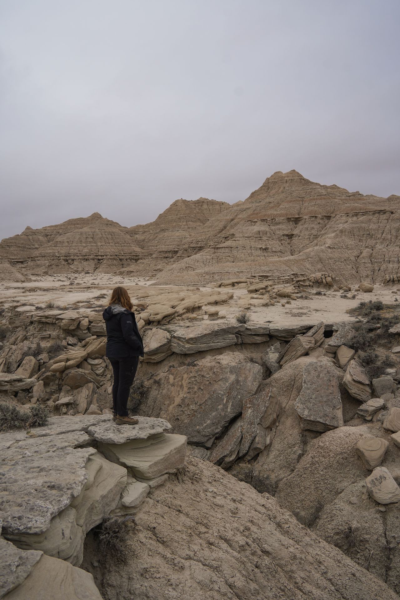 Lydia looking out at badland rock formations in Toadstool Geological Park