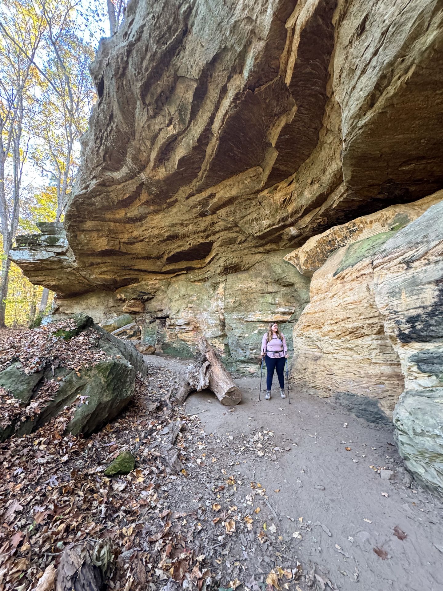 Lydia hiking next to large rocks at Patoka Lake, Indiana