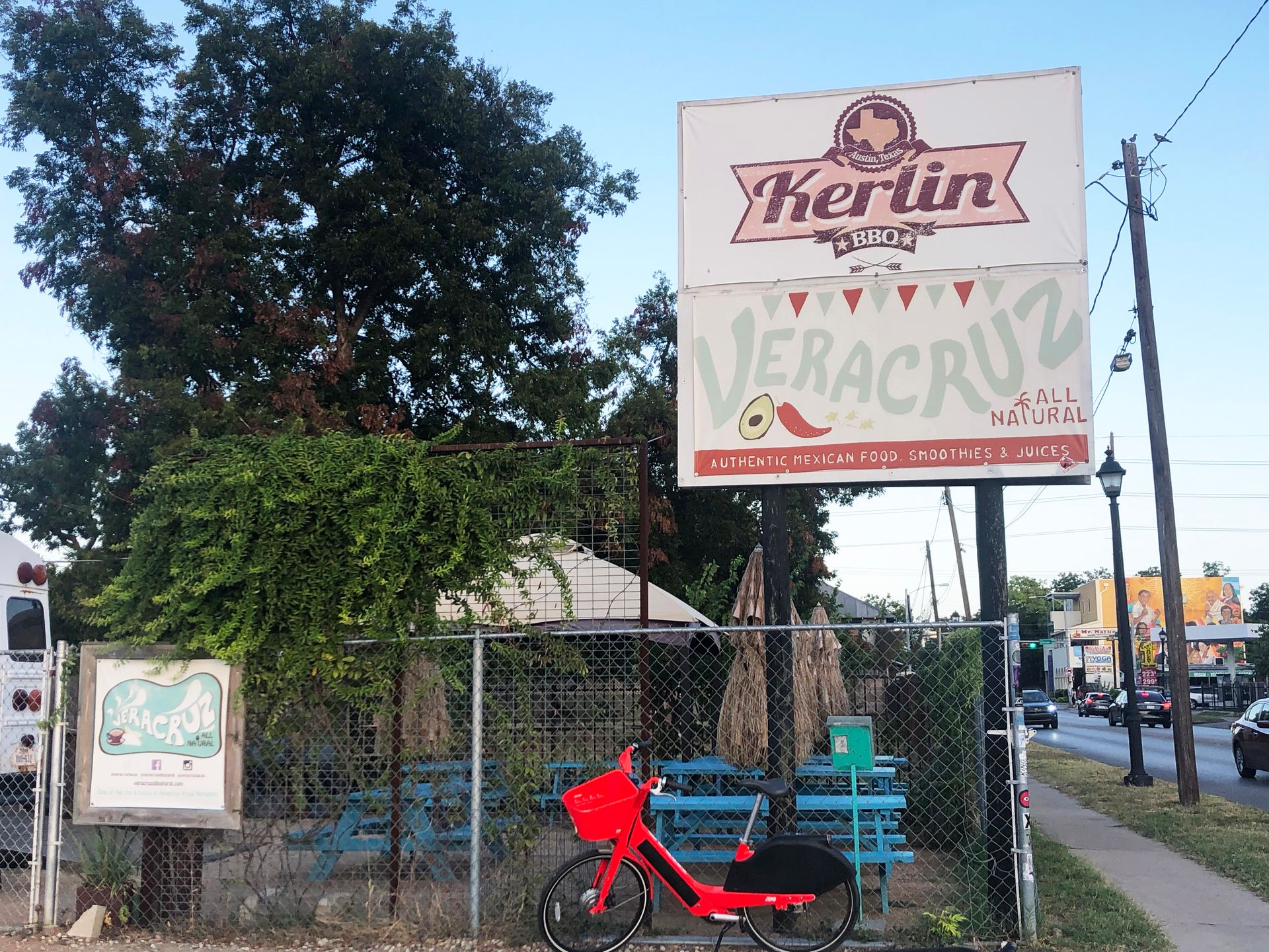 A sign for Veracruz Tacos in front of their food truck.