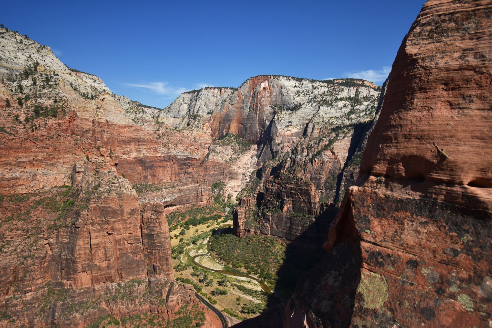 A view looking down at the tall canyon walls in Zion National Park. This is from right before the chains of Angel's Landing.