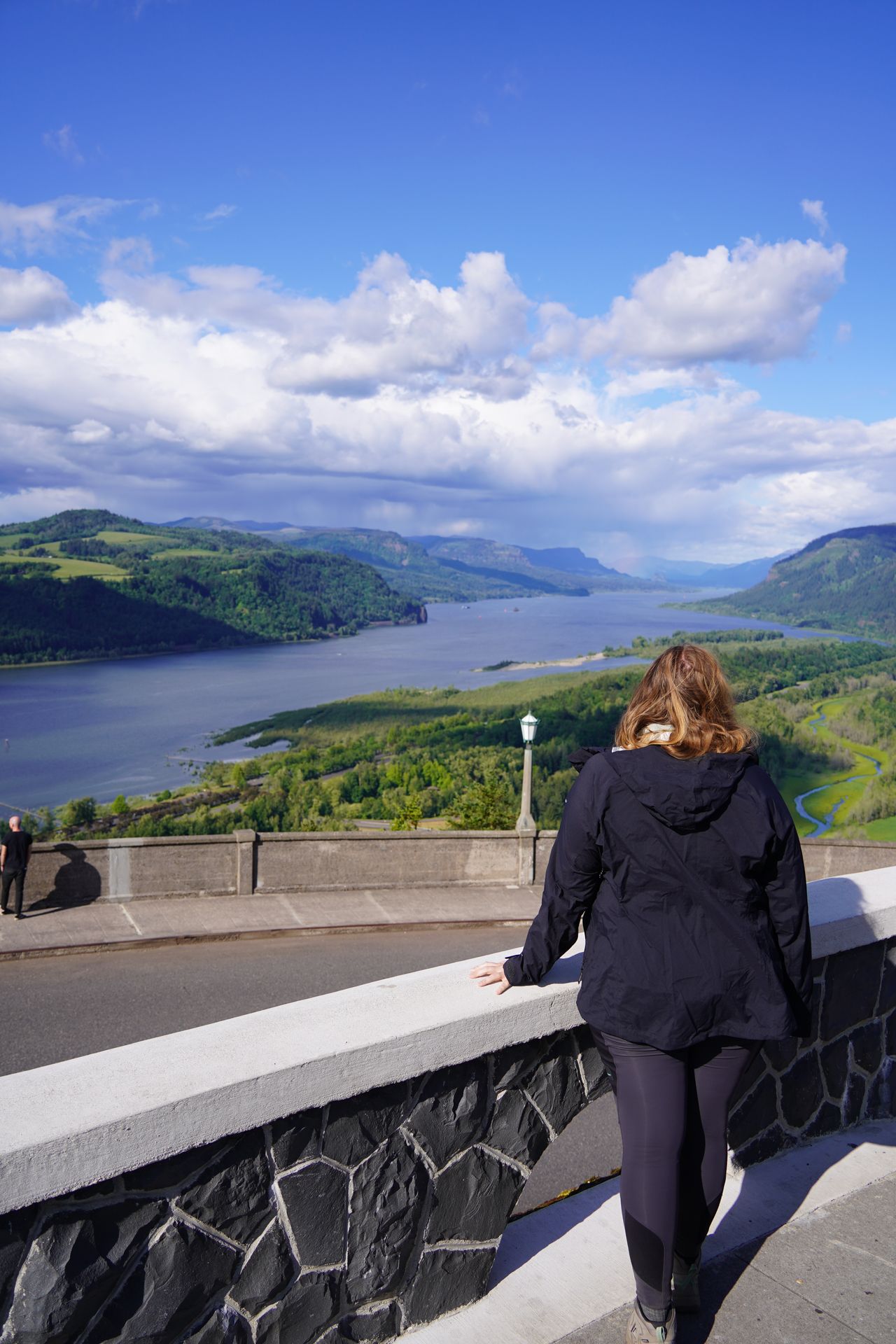 Lydia looking out at views of the Columbia River from the Vista House