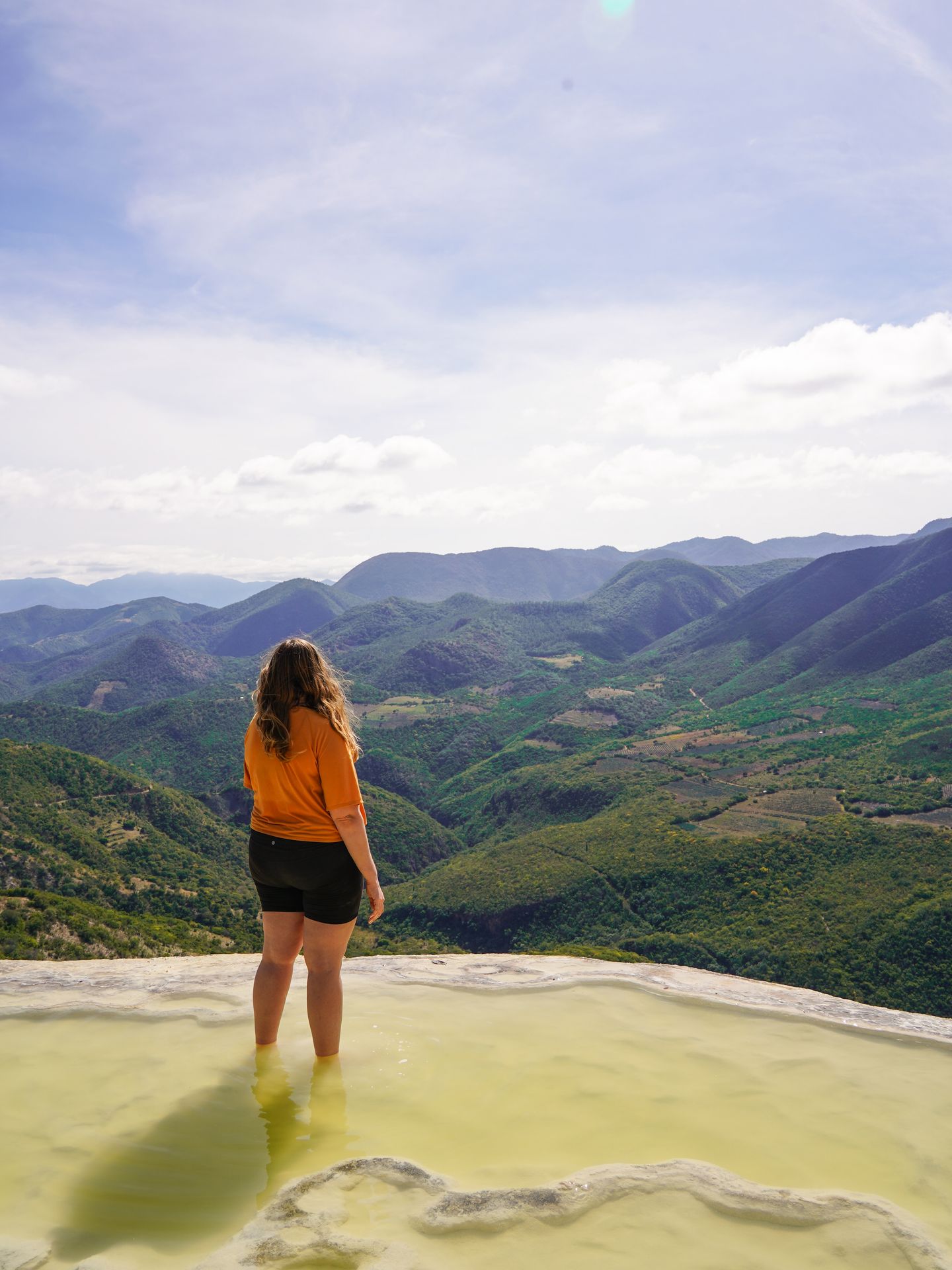 Lydia wading in the water at Hierve el Agua