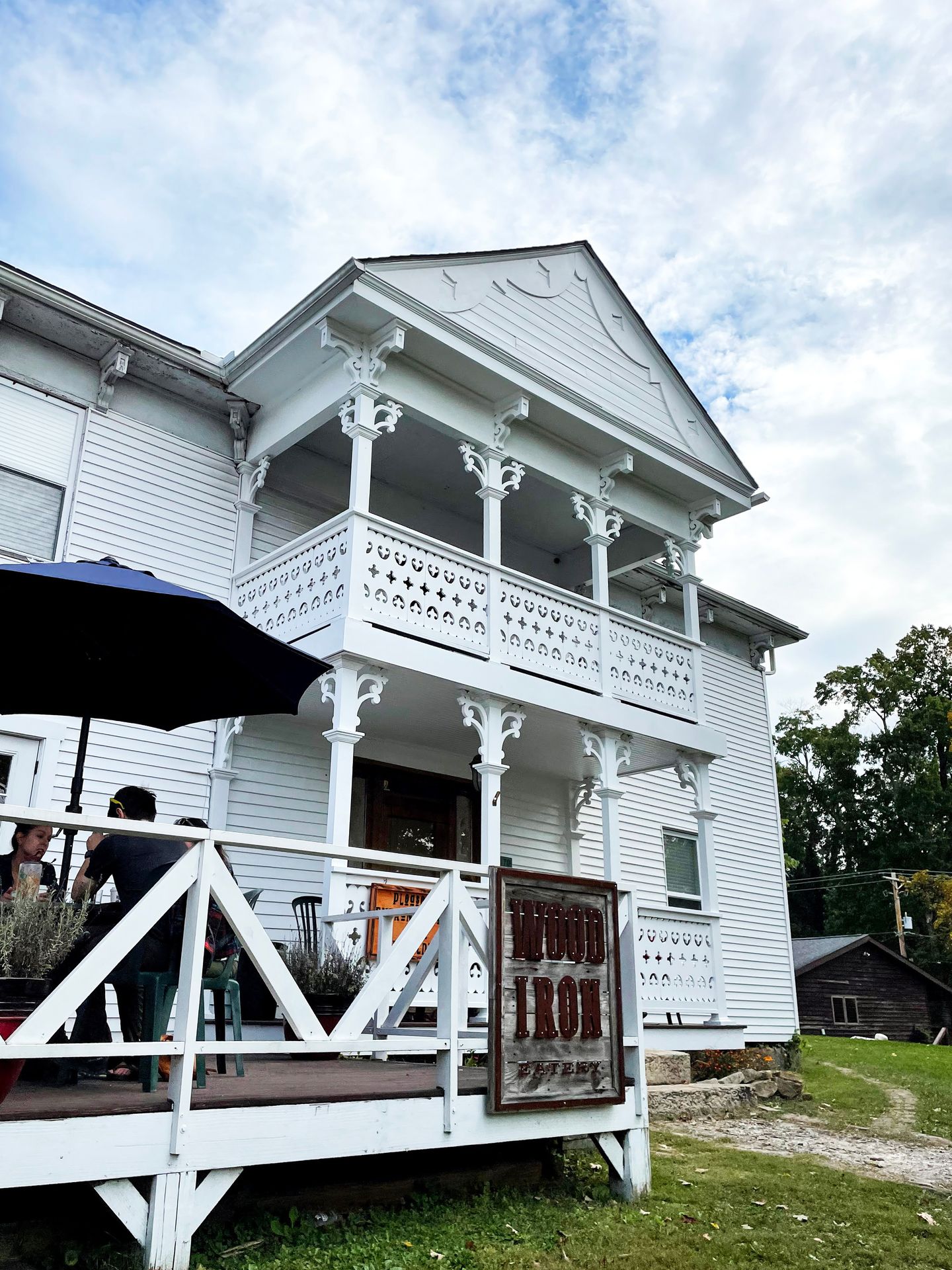 The exterior of the Wood Iron Eatery which looks like a white house.